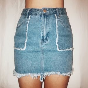 LIGHT WASH DENIM DISTRESSED MINI SKIRT